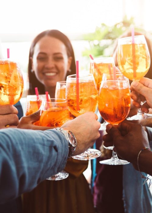 group-of-happy-friends-drinking-and-toasting-friends-at-a-bar-restaurant.jpg